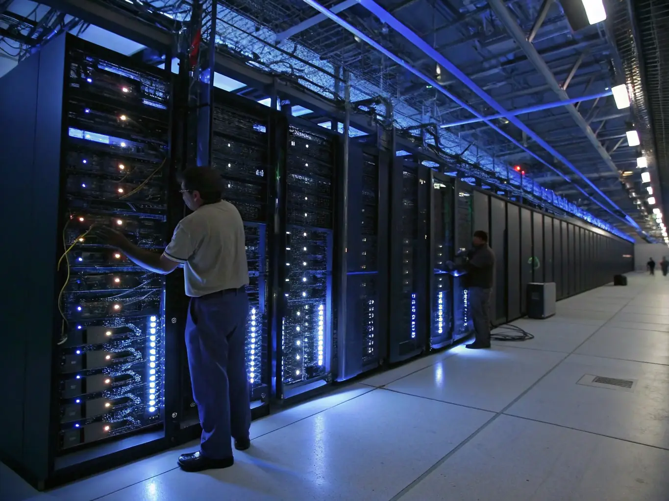 A professional photograph of a modern data center showcasing servers and networking equipment, emphasizing the infrastructure optimization services offered by BGIT Solutions.